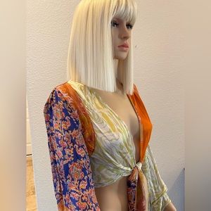 FREE PEOPLE elegant blouse with tie in front of blouse. It goes to the waist.